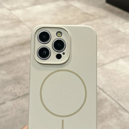 Beige iPhone with MagSafe case.