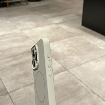 Gray smartphone with camera array and MagSafe case.