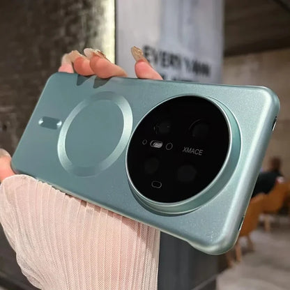 Blue-green phone case with circular camera module.