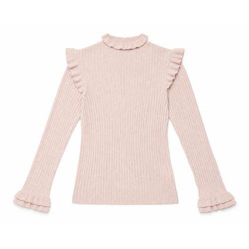 Blush pink ribbed turtleneck sweater featuring ruffle details on the collar, shoulders, and long sleeve cuffs.