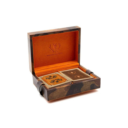Camo-print Italian saddle leather playing card case with vibrant orange interior and two decks of Martin Dingman cards.