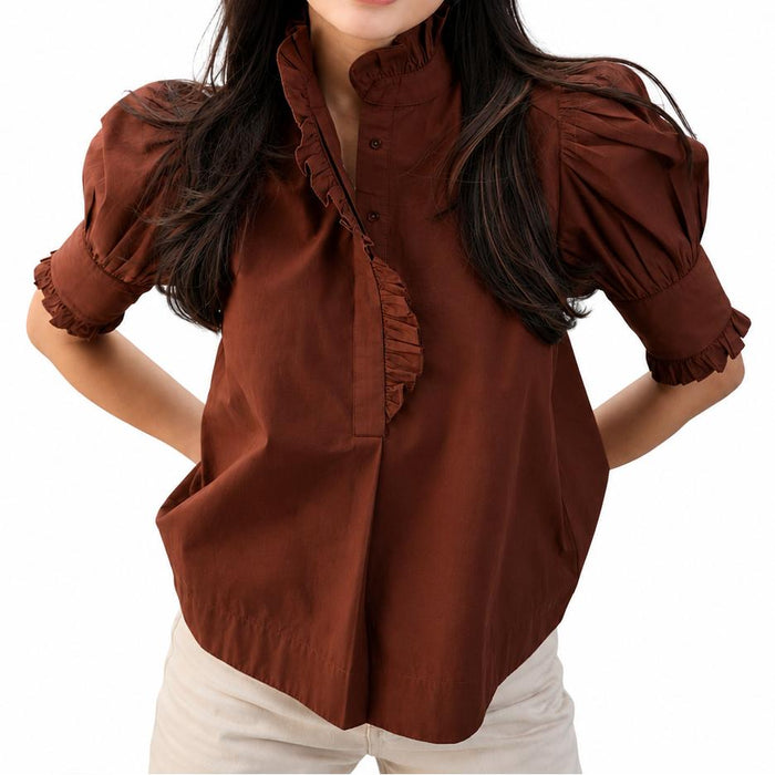 Brown cotton poplin top with puff sleeves, a ruffled stand collar, and a button placket.
