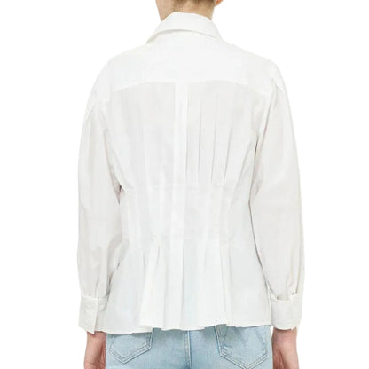 Back view of a white cotton Oliphant Elizabeth top featuring a pleated bodice and long sleeves with buttoned cuffs.