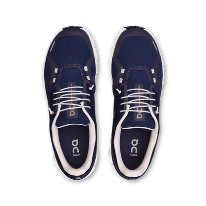 Top-down view of navy blue On Running Cloud 6 men's sneakers with white laces and cushioned CloudTec soles.