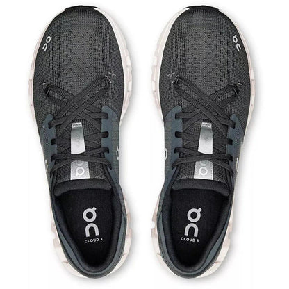 Top-down view of black On Running Cloud X 4 training shoes with breathable mesh, star lacing, and white cushioned soles.