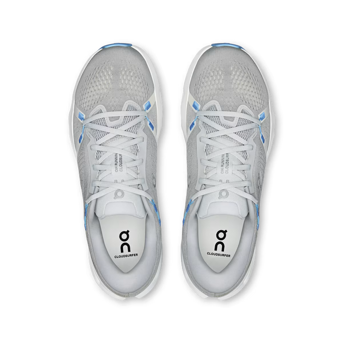 Top-down view of grey On Running Cloudsurfer 2 sneakers with breathable mesh, blue accents, and white Helion foam midsoles.