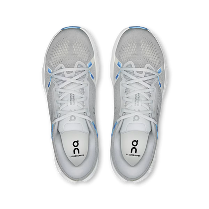 Top-down view of grey On Running Cloudsurfer 2 sneakers with breathable mesh, blue accents, and white Helion foam midsoles.