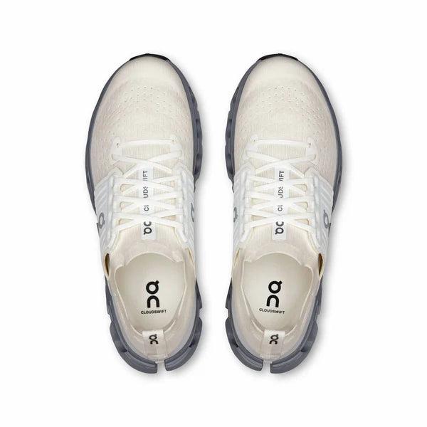 Top-down view of white On Running Cloudswift 4 road shoes with breathable mesh uppers and grey Helion foam midsoles.