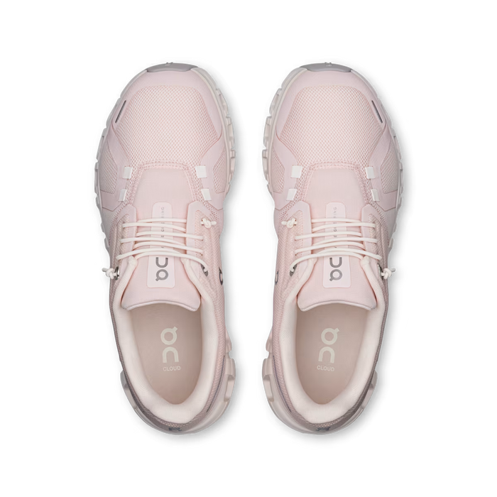 Top view of light pink On Running Women's Cloud 6 sneakers featuring breathable mesh, speed lacing, and CloudTec soles.
