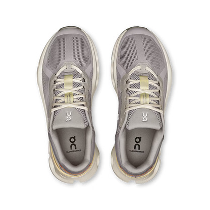 Top view of grey On Running Women's Cloudrunner 2 shoes featuring breathable mesh, cushioned midsoles, and lace-up design.