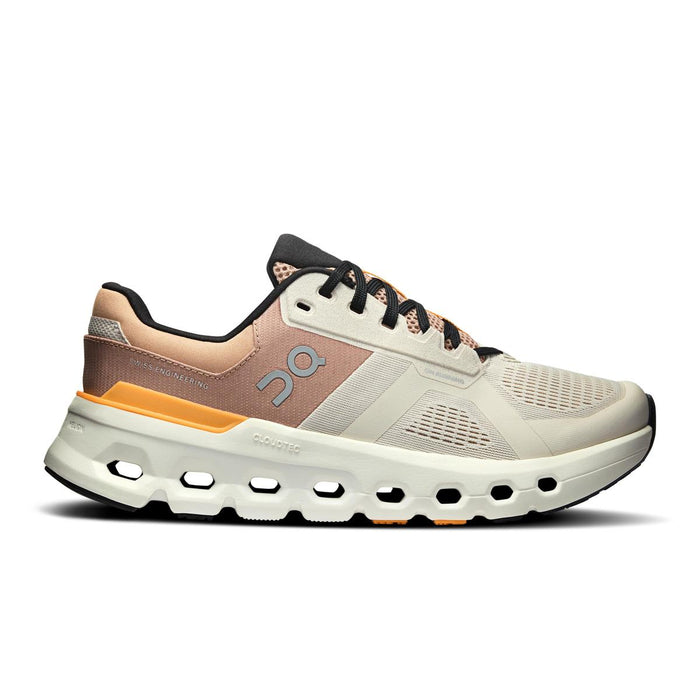 On Running Women's Cloudrunner 2 wide running shoe in beige and peach with a responsive Helion foam midsole and CloudTec sole.