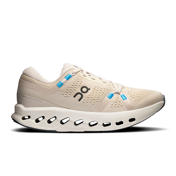Beige On Running Cloudsurfer 2 women's shoe with breathable mesh, blue accents, and a cushioned CloudTec Phase midsole.