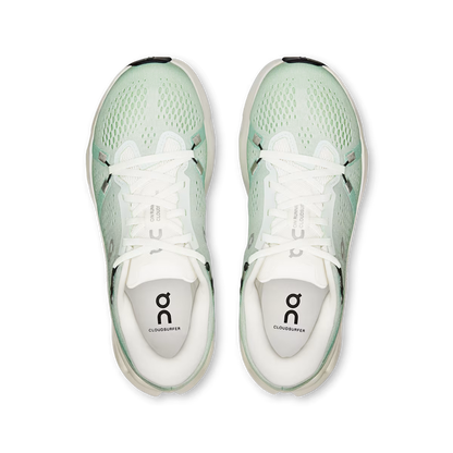 Top-down view of mint green On Running Cloudsurfer 2 women's sneakers with breathable mesh and white laces.