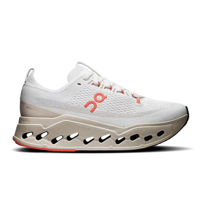 On Running Women's Cloudsurfer Max in beige with orange accents, featuring a thick, cut-out CloudTec Phase foam sole.