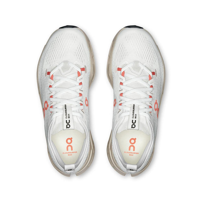 Top view of white On Running Cloudsurfer Max women's shoes with coral accents and a breathable mesh upper.