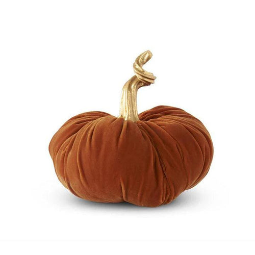 Orange velvet stuffed pumpkin decor featuring a decorative twisted gold stem on a white background.