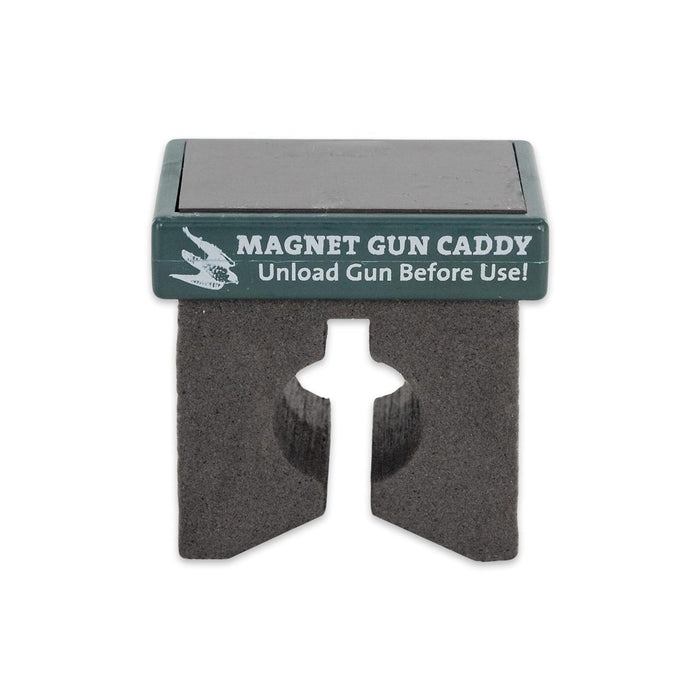 Compact magnetic gun caddy with a black foam holder and green top label for securing firearms to metal surfaces.