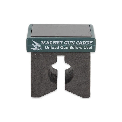 Compact magnetic gun caddy with a black foam holder and green top label for securing firearms to metal surfaces.