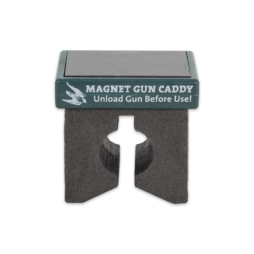 Compact magnetic gun caddy with a black foam holder and green top label for securing firearms to metal surfaces.