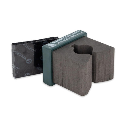 Compact gray foam magnetic gun caddy with a Velcro backing for secure firearm storage on metal or carpeted surfaces.