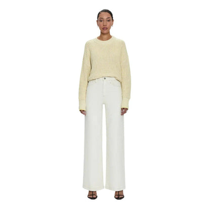 Pistola Lana high-rise ultra wide leg jeans in ecru denim with contrast stitching paired with a yellow knit sweater.