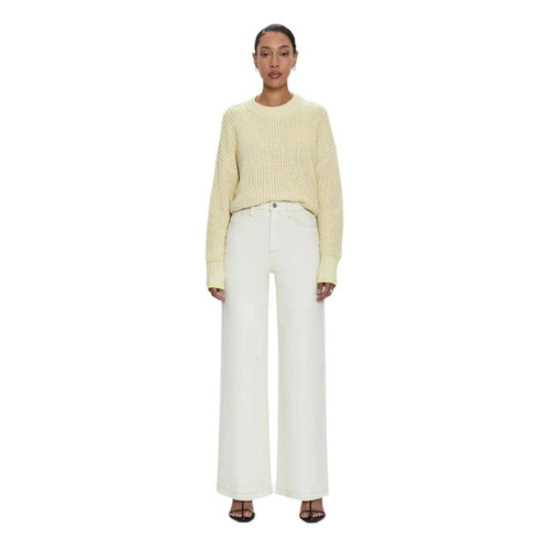 Pistola Lana high-rise ultra wide leg jeans in ecru denim with contrast stitching paired with a yellow knit sweater.