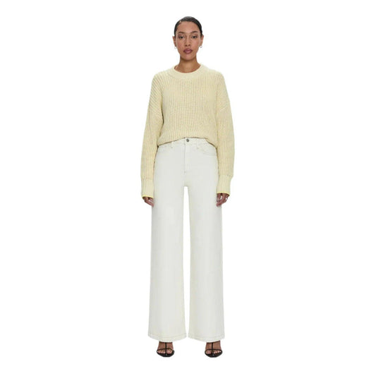Pistola Lana high-rise ultra wide leg jeans in ecru denim with contrast stitching paired with a yellow knit sweater.