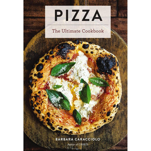 Hardcover cookbook titled Pizza featuring a wood-fired margherita pizza with fresh basil on a rustic wooden board.