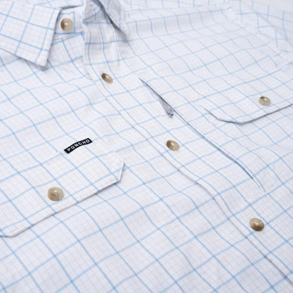 White long-sleeve button-down shirt with a light blue grid pattern, featuring magnetic chest pockets and a Poncho logo tag.