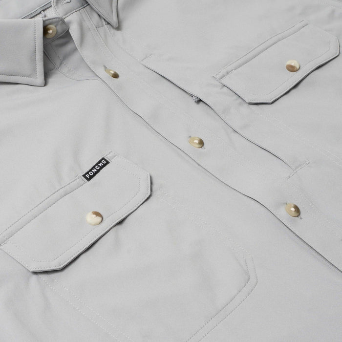 Light grey short sleeve performance shirt featuring dual chest pockets, button-down collar, and Poncho brand label.