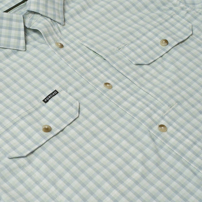 Light green and white gingham performance shirt with dual chest pockets and Poncho brand label.