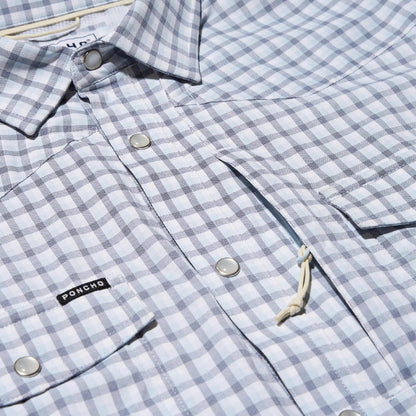 Light blue and white checkered Poncho western shirt with pearl snaps, chest pockets, and a sunglasses loop.