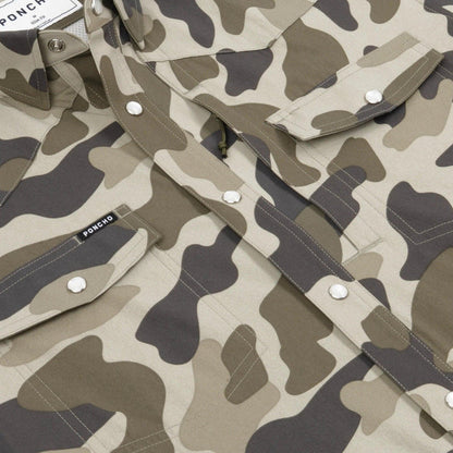Close-up of a camouflage button-up shirt with silver snap buttons