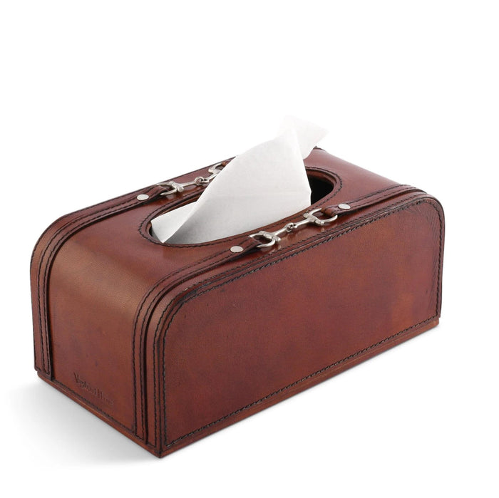 Brown genuine leather tissue box cover featuring a decorative pewter equestrian bit detail and stitched edges.