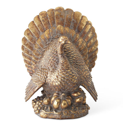 Antique gold plated resin turkey sculpture with intricate feather detailing and a decorative harvest base.