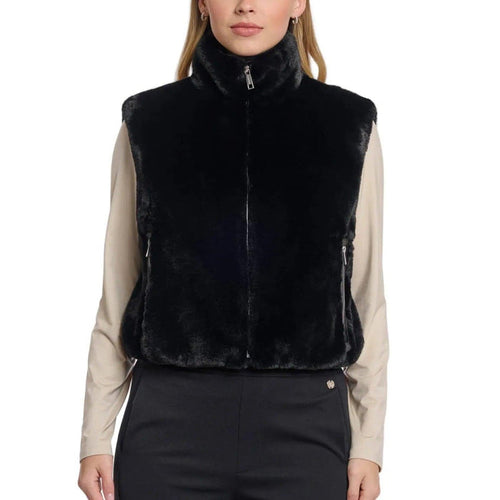 Model wearing a black Rino & Pelle short faux fur waistcoat with a high collar, zipper closure, and side pockets.