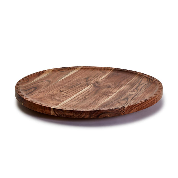 Round 20-inch rotating acacia wood charcuterie board with a natural grain finish and elegant hand-etched edge detailing.