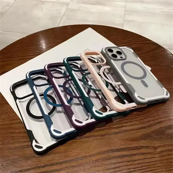 A row of five clear phone cases with colorful, reinforced edges and magnetic charging rings.