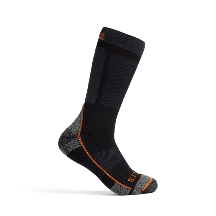 Black Sitka mid-weight crew sock with grey reinforced heel and toe, orange accents, and merino wool performance zones.