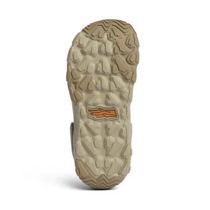 Tan Sitka Ranger Clog showing the textured, sticky rubber outsole with orange logo branding and deep traction lugs.