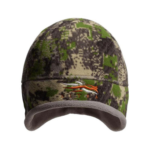 Sitka Stratus windproof micro-fleece beanie in camo print with acoustic ear ports and embroidered logo.