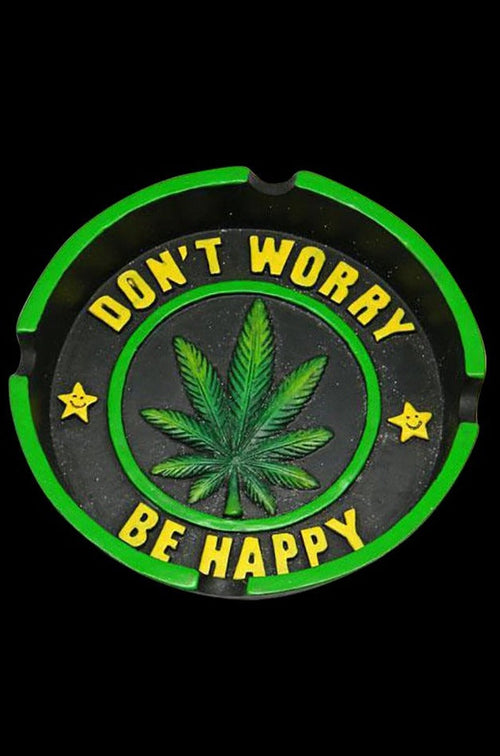 Overhead view of the Hemp Leaf Ashtray, featuring a circular design with a green leaf pattern and the words “Don’t Worry, Be Happy”.