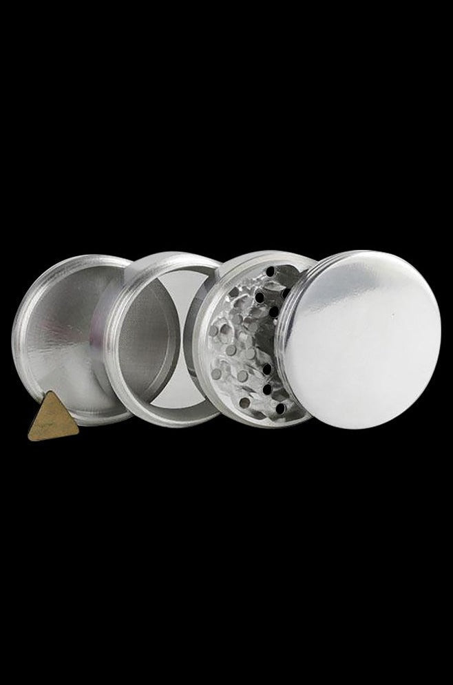 The Metal 4-Piece Grinder is shown disassembled in a circular arrangement against a black background.