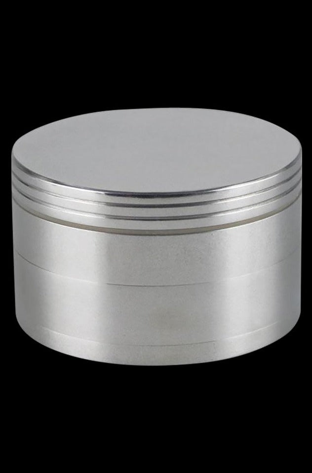 Close-up of the Metal 4-Piece Grinder, a silver, cylindrical device photographed against a solid black backdrop.