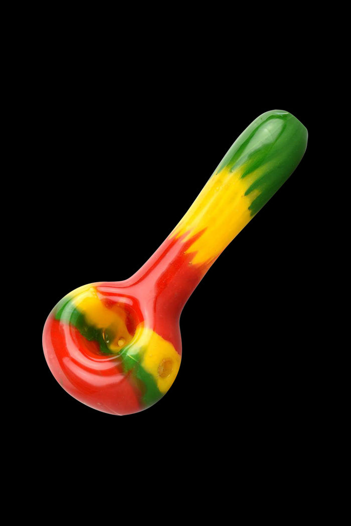 A side view of the Rasta Color Spoon Hand Pipe, featuring a colorful, curved design in a handheld format.