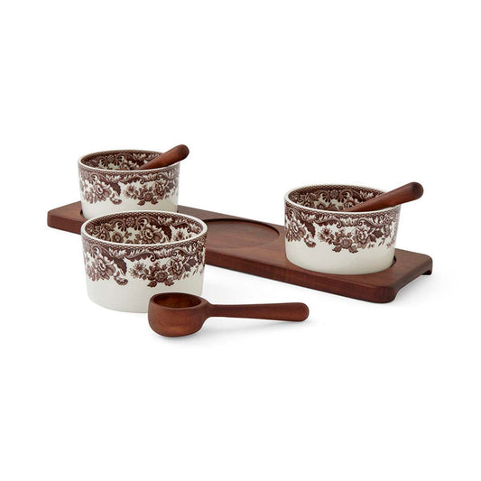 Spode Woodland 7-piece condiment set with three floral porcelain pots, wooden spoons, and a matching wooden serving tray.