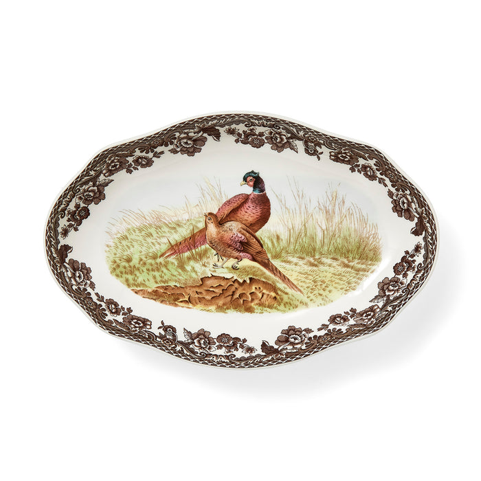 Spode Woodland 8.5-inch porcelain pickle dish featuring a pheasant illustration and brown floral border with scalloped edges.