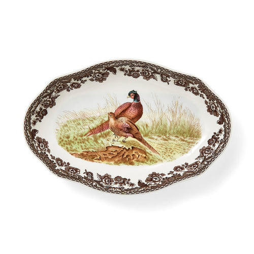Spode Woodland 8.5-inch porcelain pickle dish featuring a pheasant illustration and brown floral border with scalloped edges.