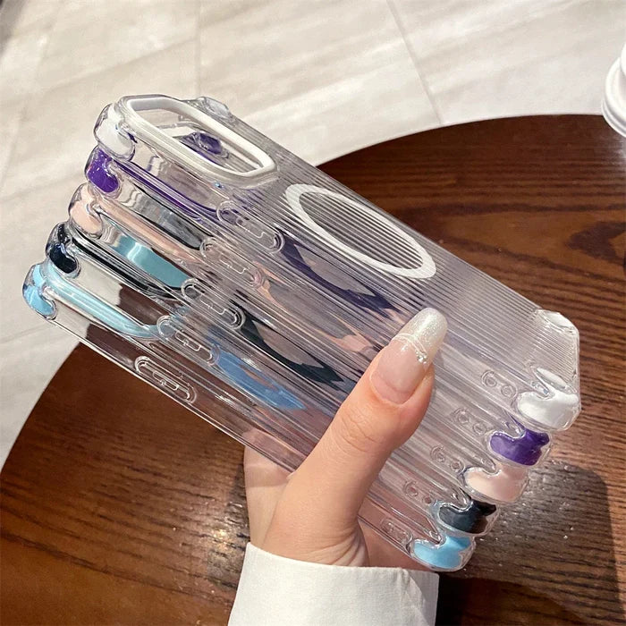 Stack of clear phone cases with colorful corner accents.