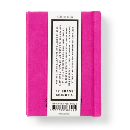 A small, bright pink book titled Tiny Diary for Not So Tiny Secrets by Brass Monkey, with a perfect bound cover and a white and black back label showing the book’s features, barcode, ISBN number, and the Brass Monkey brand.